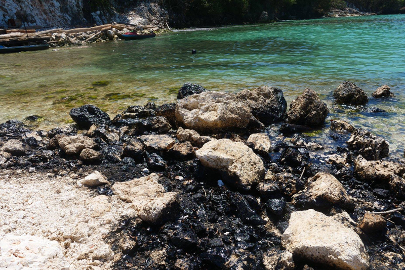 Oil on the rocks at the spill site February 26.